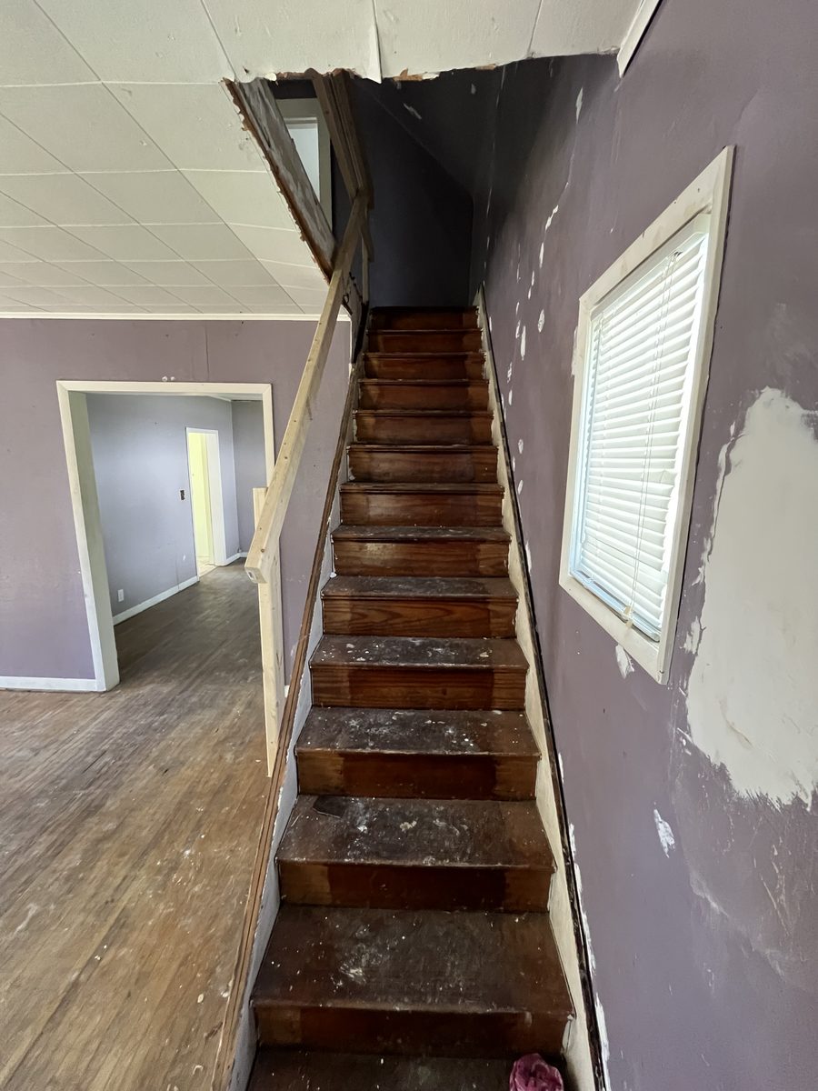 Before: Deteriorated staircase at 507 Roosevelt Ave, Kewanee IL — overwhelming repairs